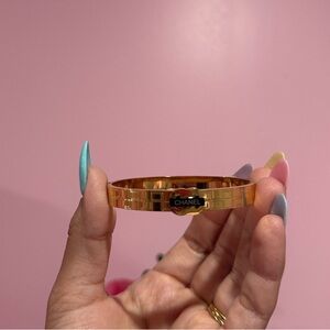 Gold-Tone Bangle with Black Logo Plaque